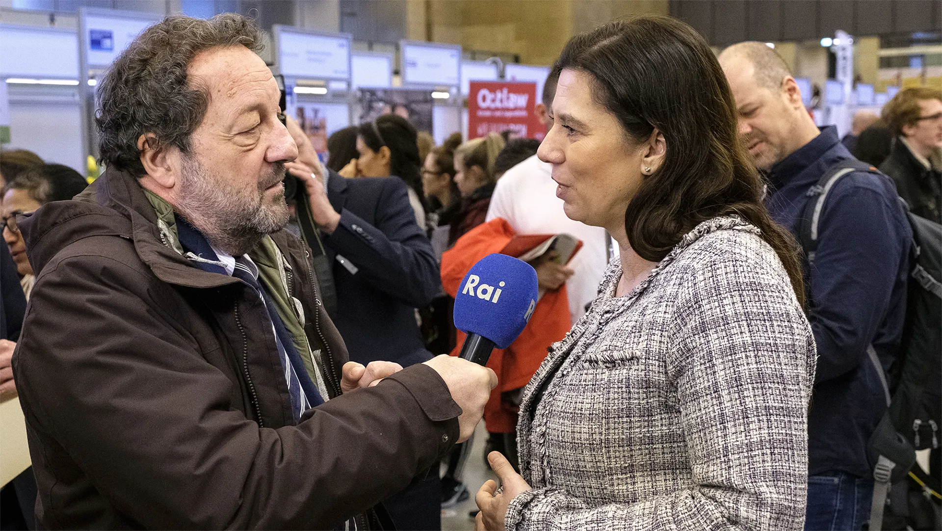 A picture shows a conversation at Berlin Tag, Germany's largest careers and information fair in the education sector.